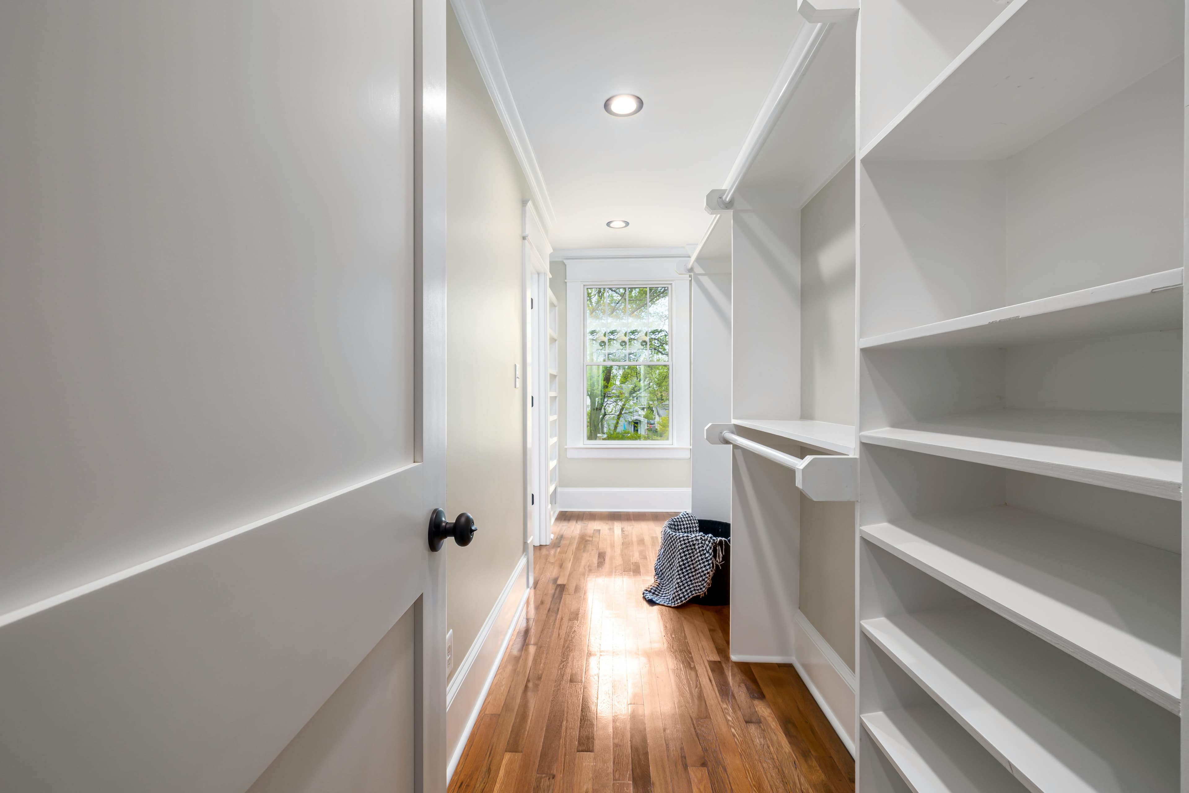 Floor-to-ceiling built-in bookcases flanking a fireplace