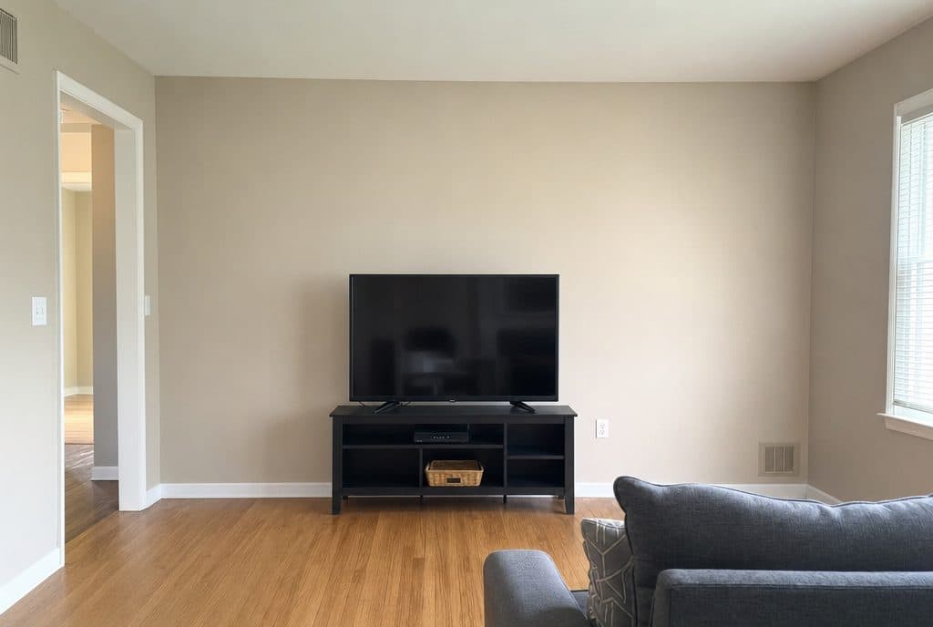 Plain beige living room wall before accent wall install